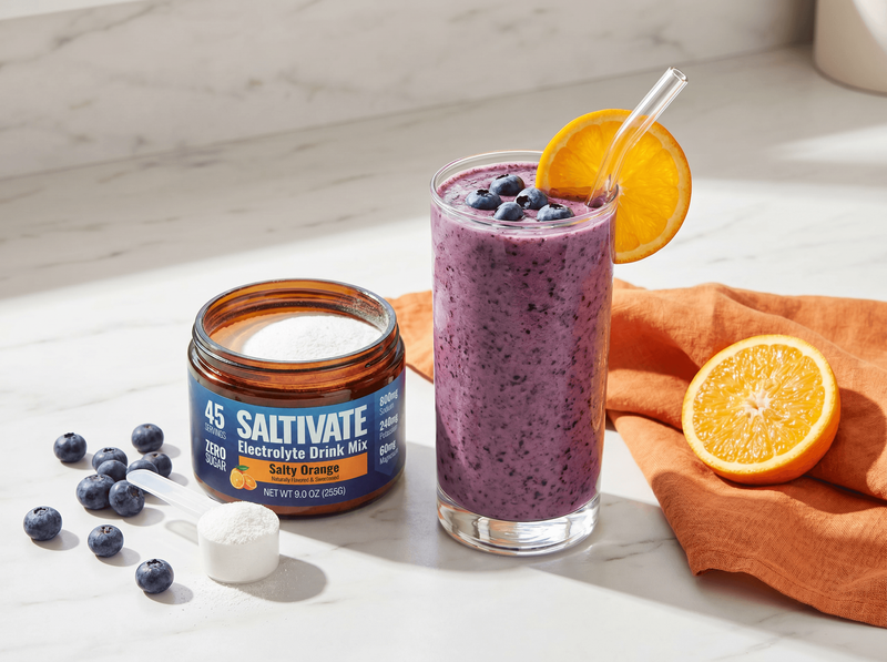 Blueberry orange smoothie with fresh blueberries and an open jar of Saltivate Orange