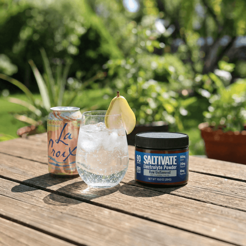 La Croix flavored seltzer poured over ice with a jar of Saltivate Raw Unflavored