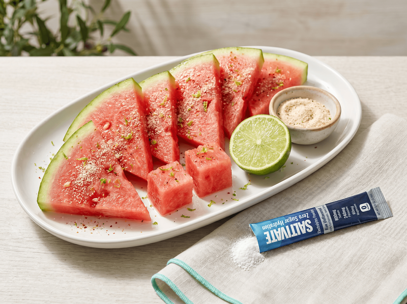 Salted watermelon wedges with chili-lime seasoning and a torn Saltivate stick packet
