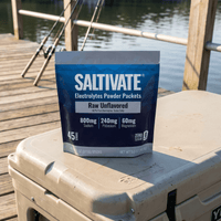 Saltivate Raw Unflavored 45-count packets pouch on a cooler at a fishing dock