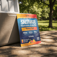 Saltivate Variety Pack 6-count pouch leaning against a cooler on a picnic table in a park