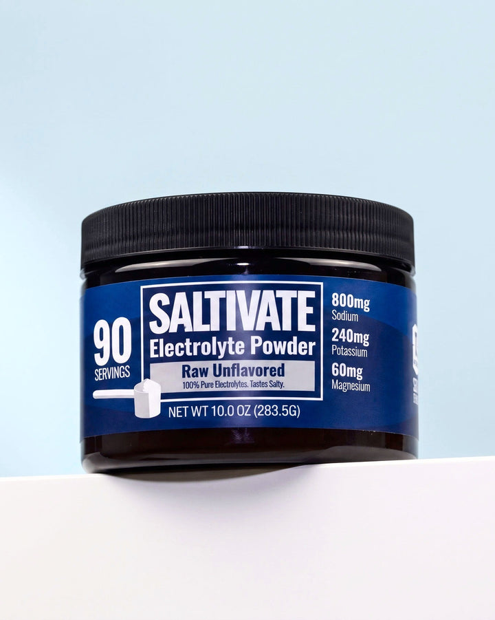 Saltivate Raw Unflavored jar on a white ledge against a pale blue-grey backdrop