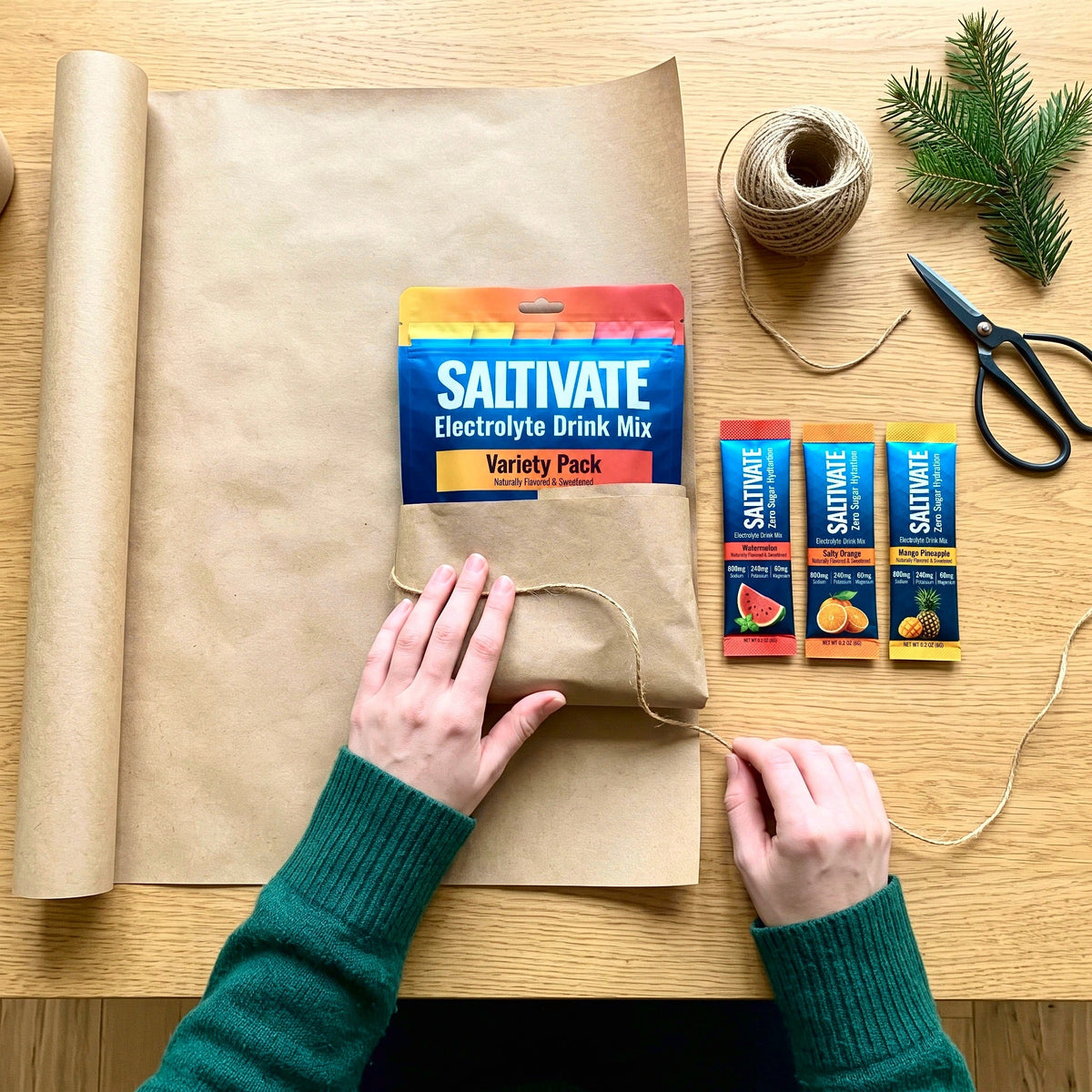 Hands wrapping a Saltivate 6-stick Variety sampler in kraft paper