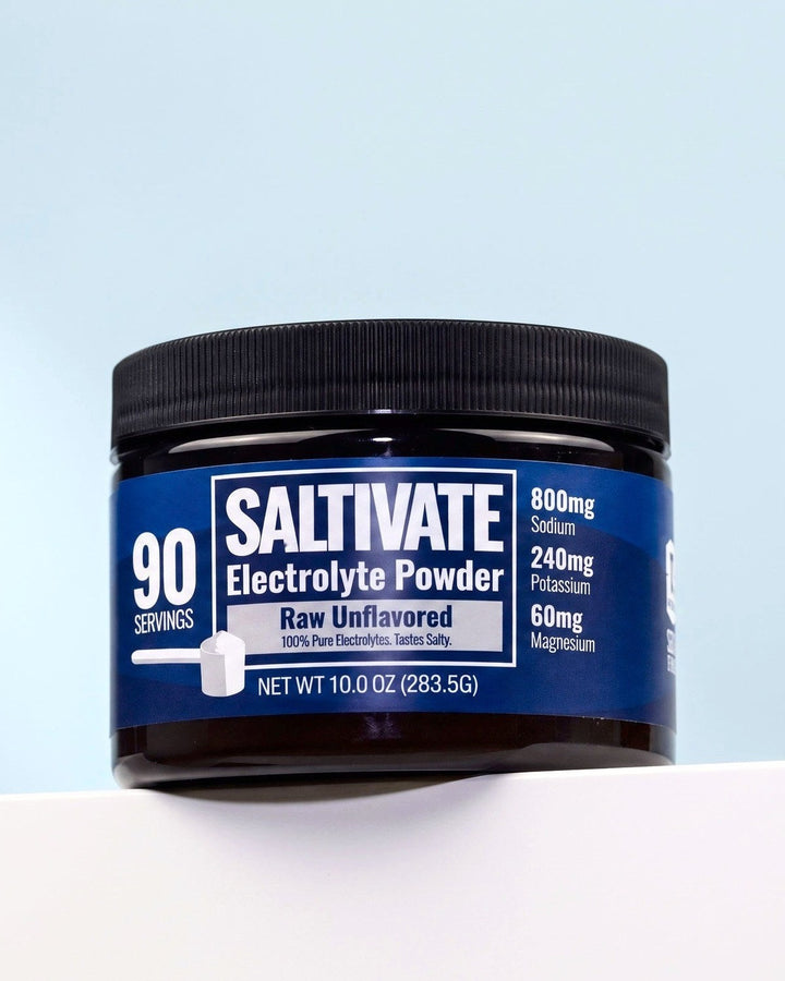 Saltivate Raw Unflavored jar on a white ledge against a pale blue-grey backdrop