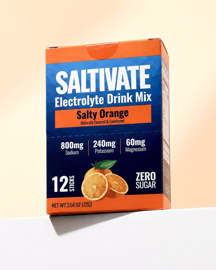 Saltivate Salty Orange 12-stick carton on a white ledge against a pale peach backdrop