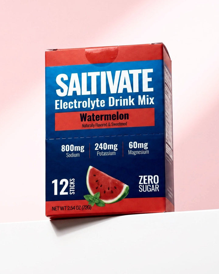 Saltivate Watermelon 12-stick carton on a white ledge against a pale pink backdrop